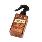 Load image into Gallery viewer, A bottle of 'Wild Carrot' tanning oil with a spray pump